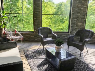 Remodel Your Porch into a Three-Season Sun Room with Faux Stone Panels